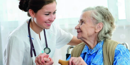 Nurse assisting elderly